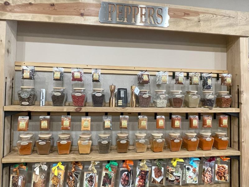 Display shelving with various pepper spices