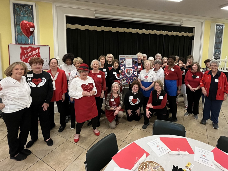 Group of women wearing red, white and black 