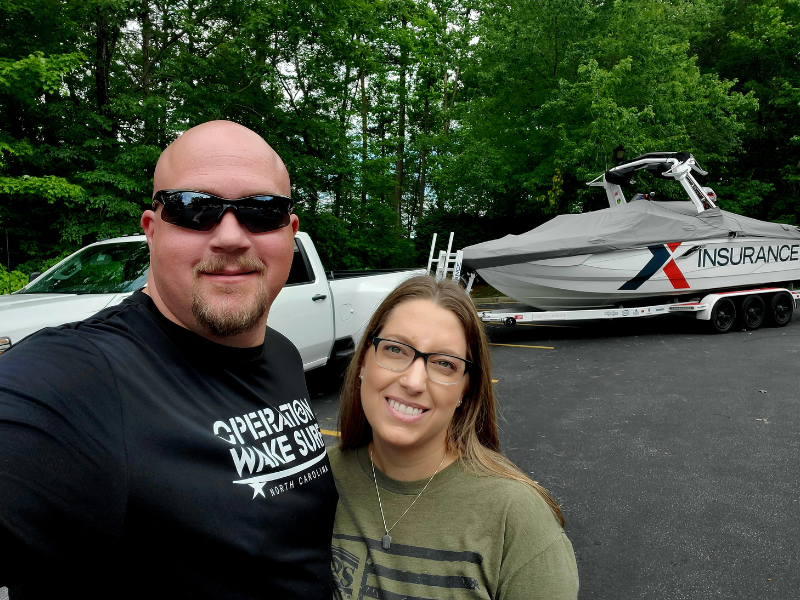 The Partner Foundation founders in front of a boat