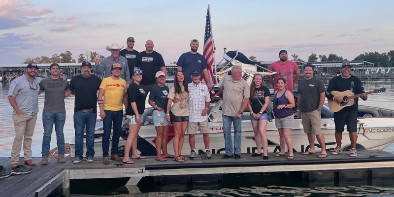 The Partner Foundation group on a dock