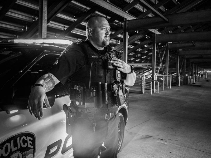 Officer Kyle Baker and a police car