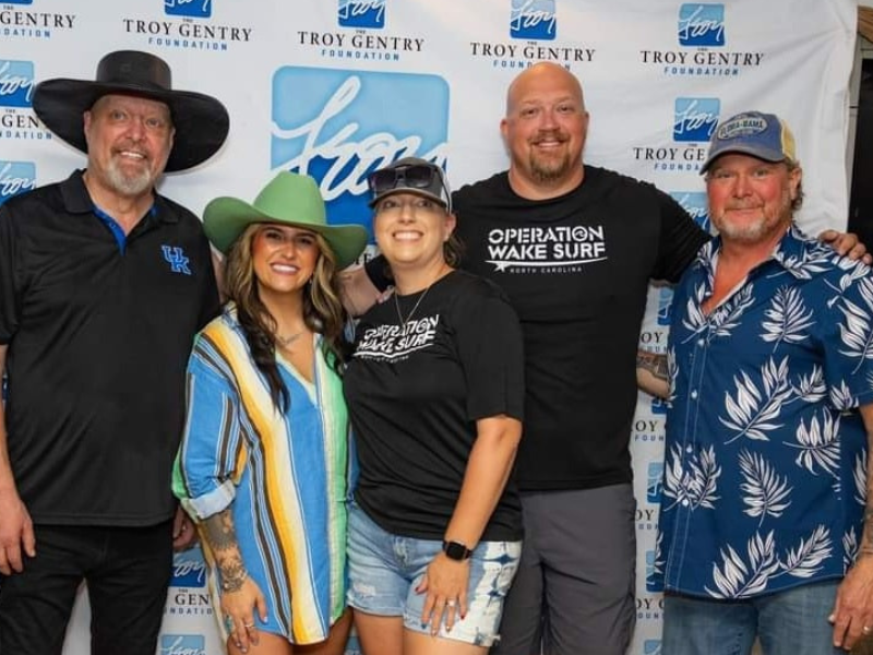 The Partner Foundation founders wearing Operation Wake Surf shirts